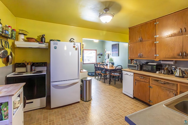 kitchen featuring sink and white appliances