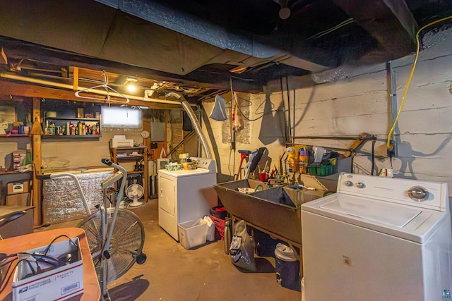 basement with separate washer and dryer and sink