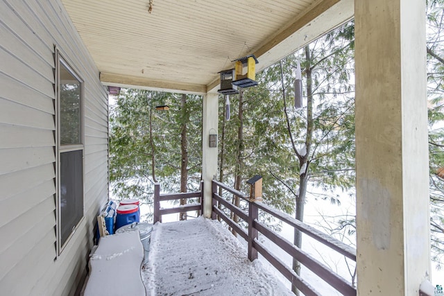 view of snow covered deck