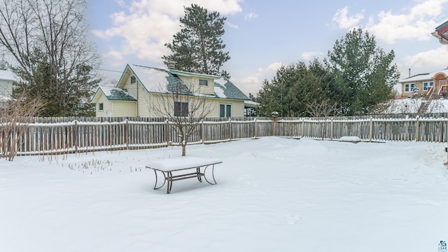 view of yard layered in snow