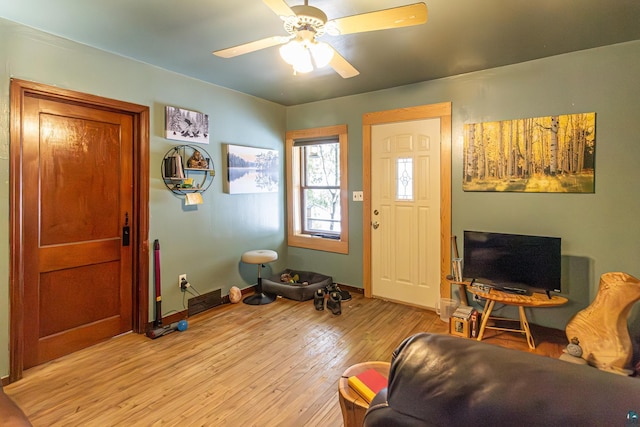 foyer featuring ceiling fan and light wood-type flooring