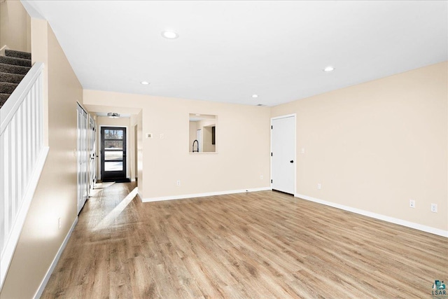 spare room featuring light wood-type flooring