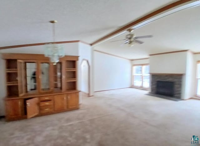 unfurnished living room with lofted ceiling with beams, ceiling fan, and light colored carpet