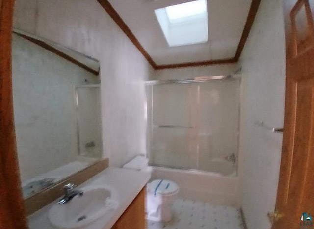 full bathroom with toilet, crown molding, a skylight, shower / bathing tub combination, and vanity