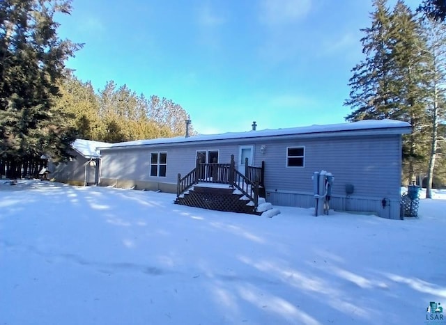 view of snow covered house