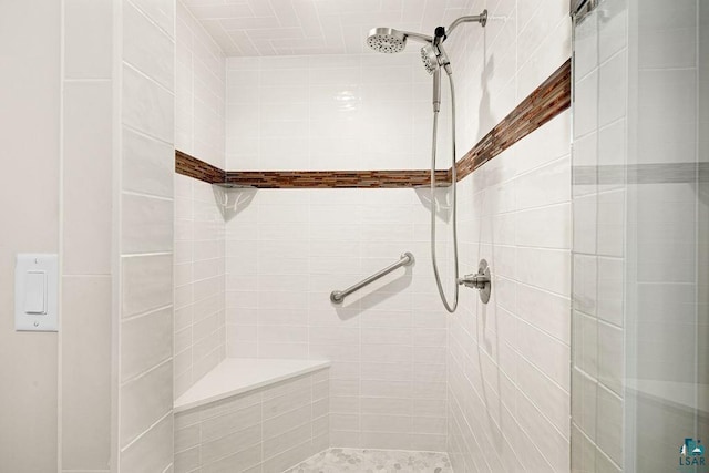 bathroom with tiled shower