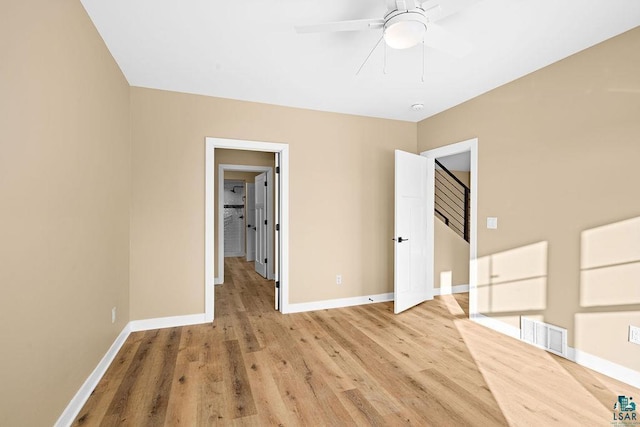 spare room featuring ceiling fan and light wood-type flooring