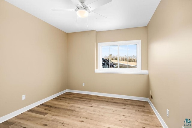 spare room featuring ceiling fan and light wood-type flooring