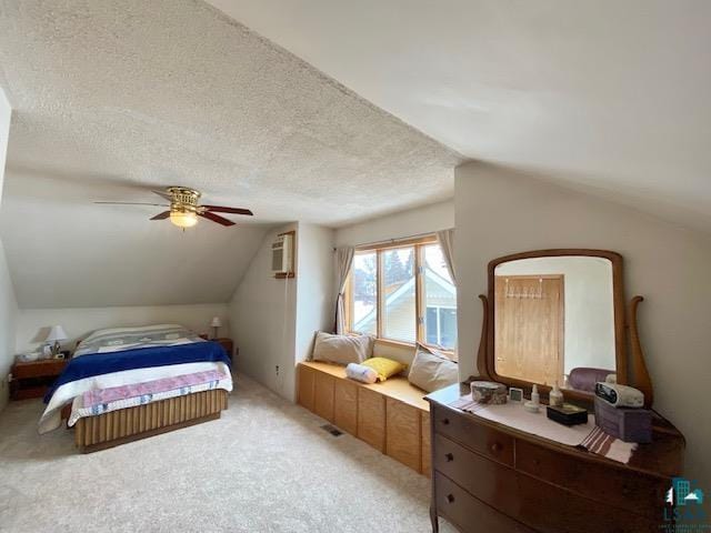 carpeted bedroom featuring ceiling fan, lofted ceiling, an AC wall unit, and a textured ceiling