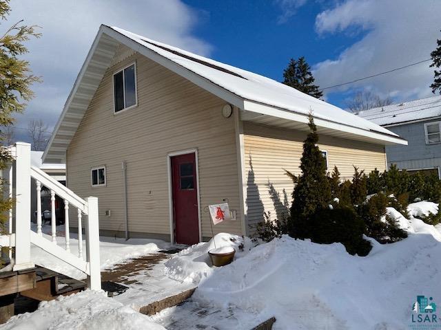 view of snow covered house