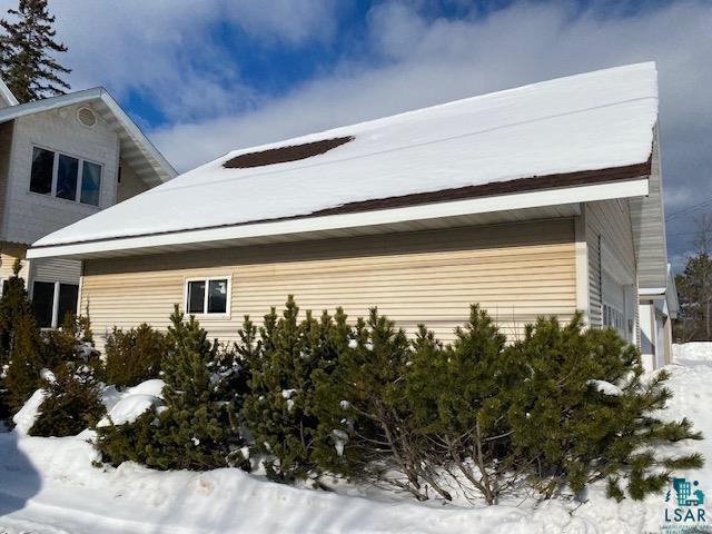 view of snow covered property