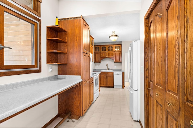 kitchen with sink and white appliances