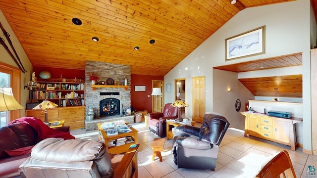 living room featuring light tile patterned floors, a fireplace, wooden ceiling, and high vaulted ceiling