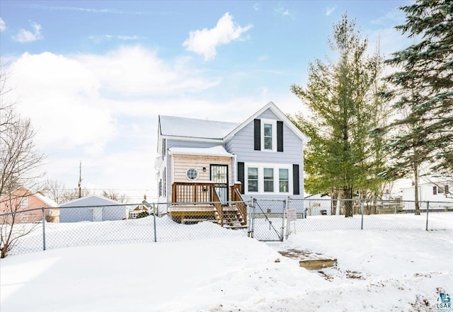 view of snow covered rear of property