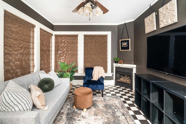 living room featuring ornamental molding and ceiling fan