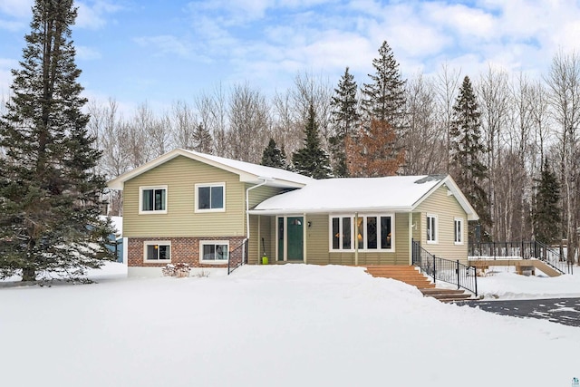 view of snow covered house