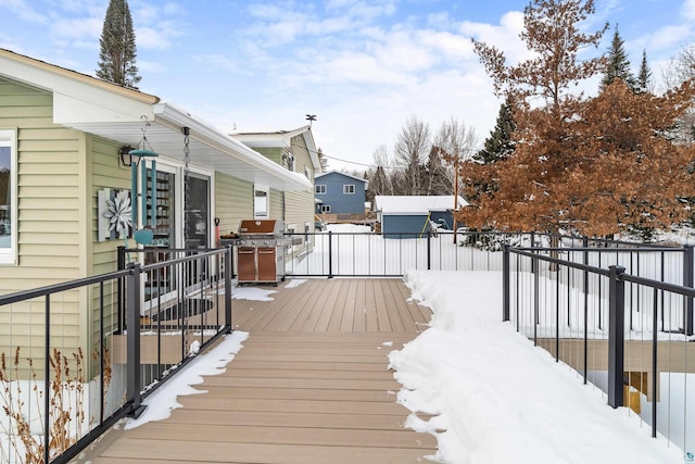 snow covered deck with area for grilling