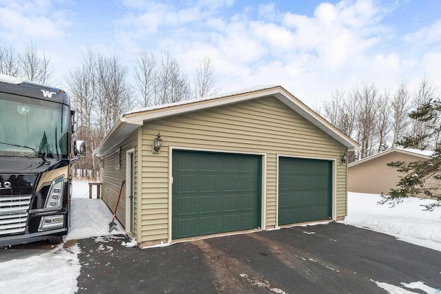 view of snow covered garage