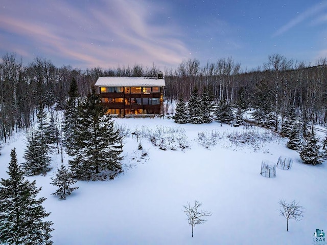 view of snow covered property