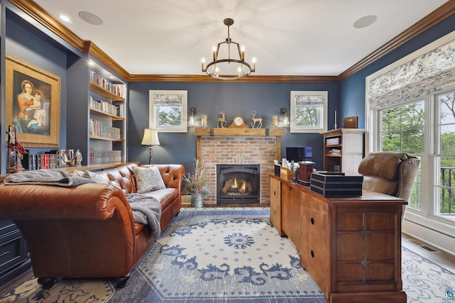 interior space featuring a brick fireplace, a notable chandelier, and ornamental molding