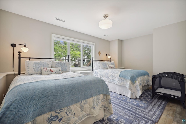 bedroom featuring wood-type flooring