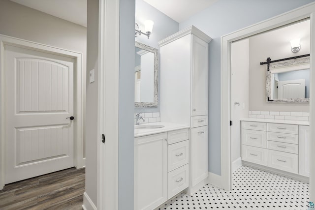 bathroom featuring vanity and hardwood / wood-style floors