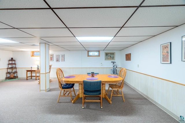 dining room with carpet and a drop ceiling