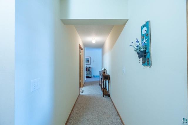 hallway with light carpet