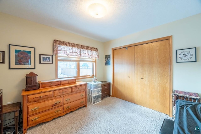 carpeted bedroom with a closet