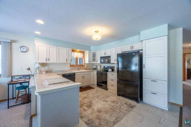 kitchen with sink, white cabinetry, a textured ceiling, kitchen peninsula, and black appliances