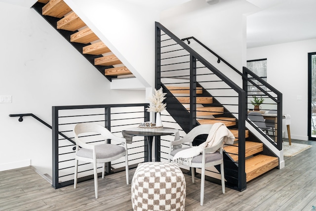 staircase with wood-type flooring