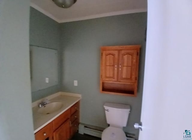 bathroom with vanity, a baseboard heating unit, crown molding, and toilet