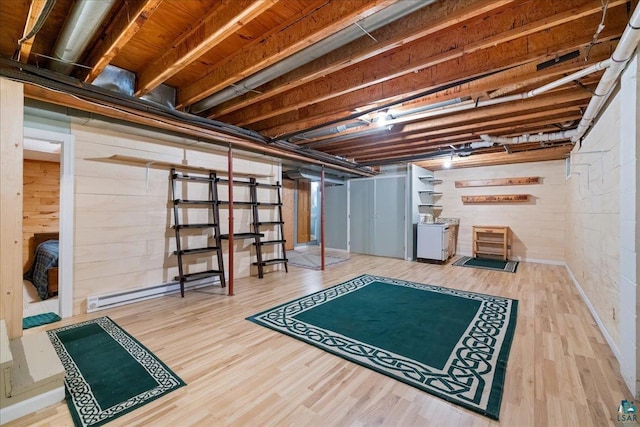 interior space with wood-type flooring and washer / dryer