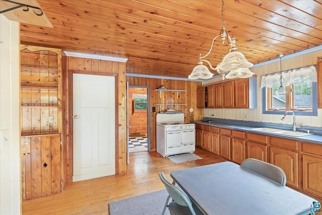 kitchen with wood ceiling, sink, decorative light fixtures, and white gas stove