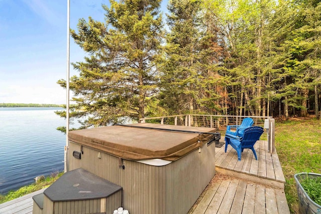 1480 Devil Track Rd, Grand Marais, MN 55604 - wooden deck featuring a hot tub and a water view
