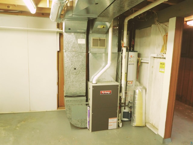 utility room featuring water heater