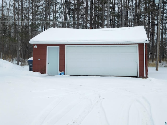 view of snow covered garage