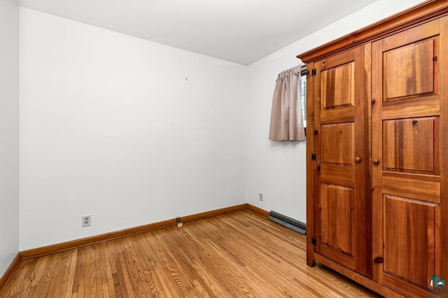 unfurnished bedroom featuring light wood-type flooring