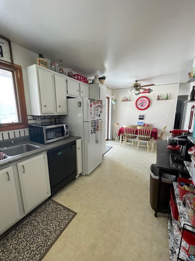 kitchen with sink, dishwasher, white fridge, ceiling fan, and white cabinets