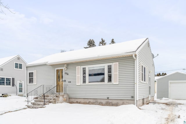 view of front of property featuring an outbuilding and a garage