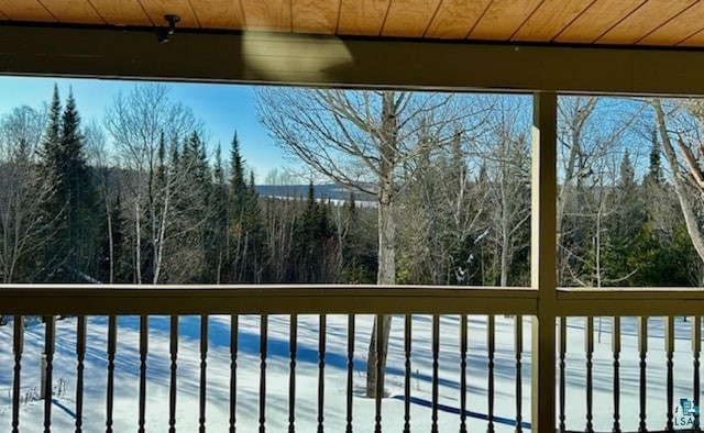 unfurnished sunroom featuring wood ceiling