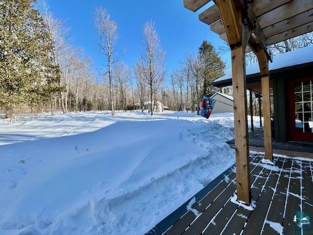 view of yard layered in snow