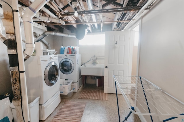 laundry area with washer and dryer and sink