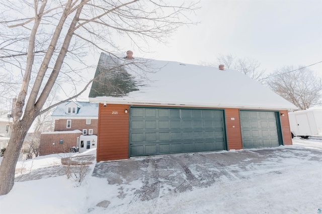 view of snow covered garage