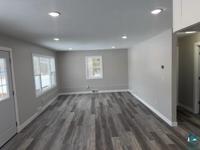 interior space with dark hardwood / wood-style flooring