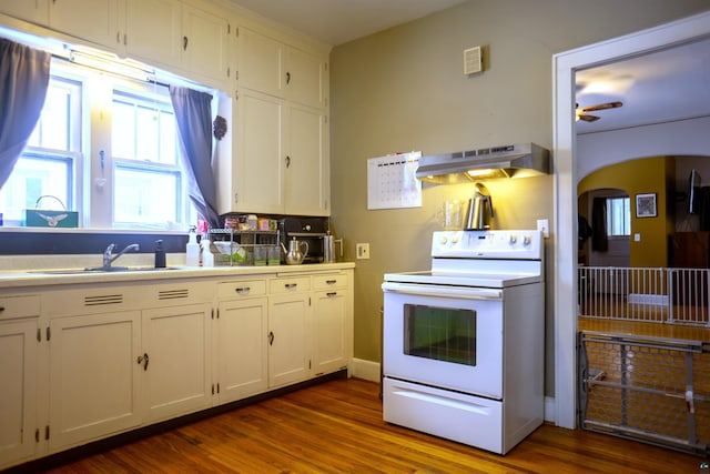 kitchen with sink, electric stove, dark hardwood / wood-style floors, and white cabinets