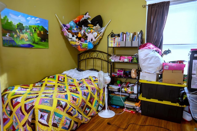 bedroom featuring hardwood / wood-style flooring