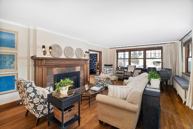 living area featuring dark wood-style flooring, a high end fireplace, and crown molding