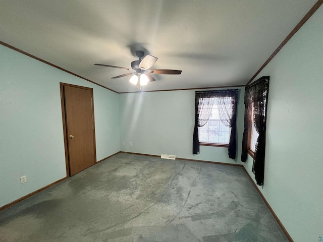 unfurnished room featuring baseboards, ornamental molding, visible vents, and light colored carpet