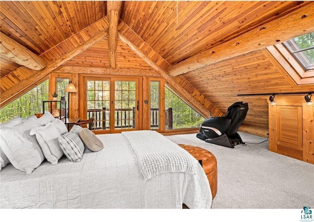 bedroom with carpet floors, multiple windows, and wooden walls